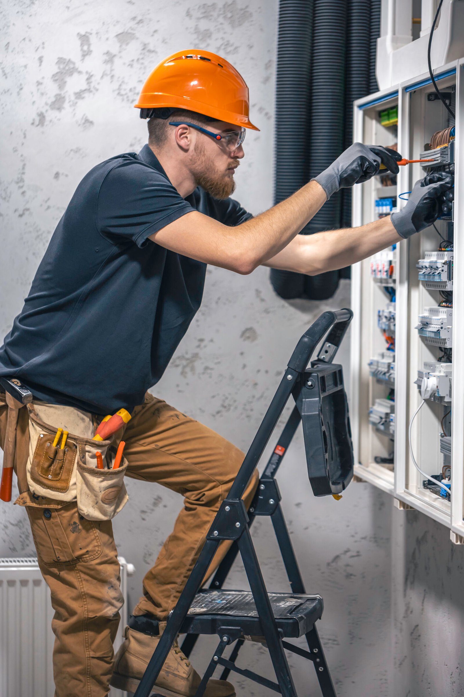 un-electricista-trabaja-en-una-central-electrica-con-un-cable-de-conexion-electrica A male electrician works in a switchboard with an electrical connecting cable. Electrician with screwdriver tightens electrically operated switching equipment in fuse box. SSUCv3H4sIAAAAAAAACpySz26DMAzG75P2DijnIpXSANurVDuYJBSraVIlodNU9d2XP1B5193wz/ZnfzGP97eqYiN4FOyzeqQoxqj14oODgNZEvN+t3CkjlaPk7tpuTwEgjZTEYB2CpnCEIGYDVxWhWbRO+JmTzAcIi1c+7bIiAUGdo0aBL4my8KnE1ZbIydgRU4ztCPPLmNmGivi/OsvH18vwWRnxkxcmRpzSCoqRUylll++g3JVag0WiJa7uVoBOBS1RAryBgz99N4cCzZkQG+Z8l01J2MUEl7Z6mWHa2huMOr36FMeojc/gfSyXGyezRfwL7JXMMTZkT6sqk/E4KWzalvOh5d2eH3h/6A/DWlAOOmPUyetsQjEWF5TUFaYN2CCE6JrhWHd86OvjpJoaunGqoembj0lxKXsZb/H8BQAA//8DAN+Xh7m5AgAA